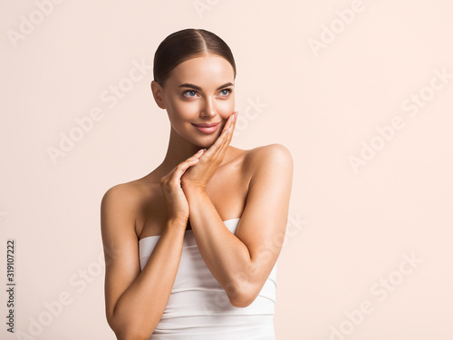 Beautiful hands face woman natural tanned skin healthy beauty female spa portait