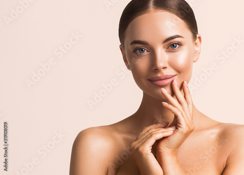 Woman beauty face pink background  healthy skin natural make up 