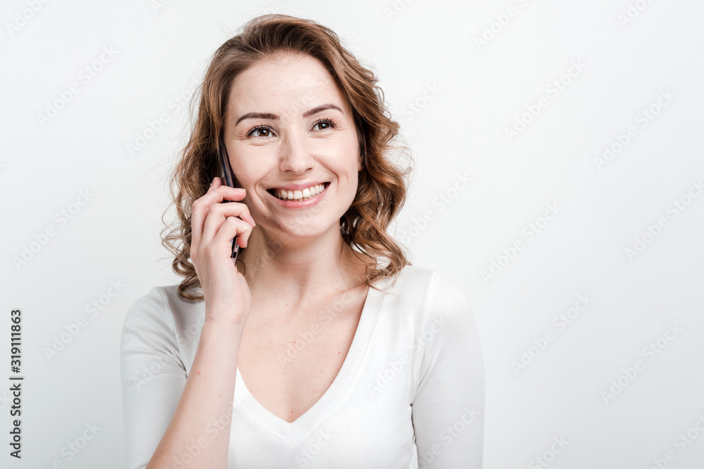 Close up, smiling girl talking on the phone. Close up, smiling girl talking on the phone.