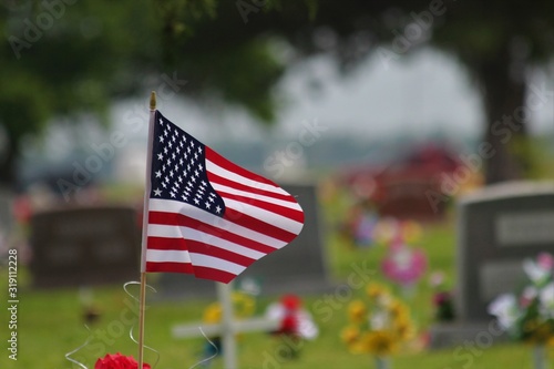 US Flag in a cemetery on Memorial day shot closeup.