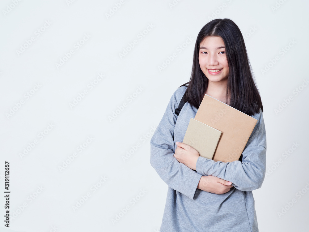 Girl student holding books with backpacks. Girl student holding books with backpacks.
