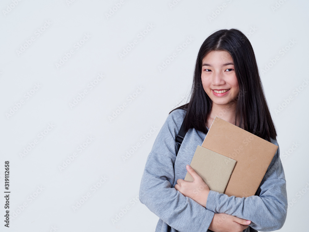 Girl student holding books with backpacks. Girl student holding books with backpacks.