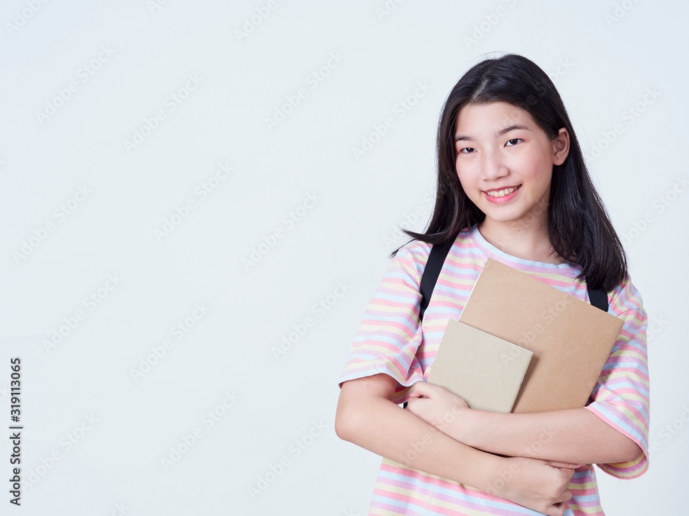 Girl student holding books with backpacks. Girl student holding books with backpacks.
