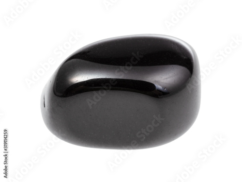 tumbled black onyx gemstone isolated on white photo