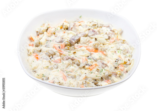 portion of russian Olivier salad in white bowl