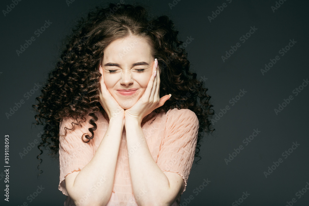 Curly hair woman closed eyes funny long hairstyle closeup face portarit Curly hair woman closed eyes funny long hairstyle closeup face portarit