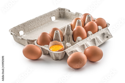 Konstfotografi Fresh chicken eggs in pater tray with broken egg isolated on white