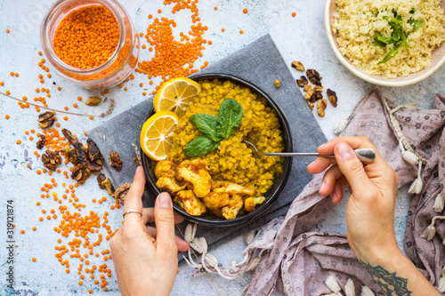 Lentil masala red dal cooked with cauliflower vegetables. Vegan Indian healthy food 