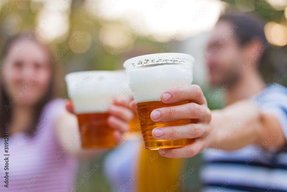 Friends enjoying drinking beer in the backyard. Friends enjoying drinking beer in the backyard.
