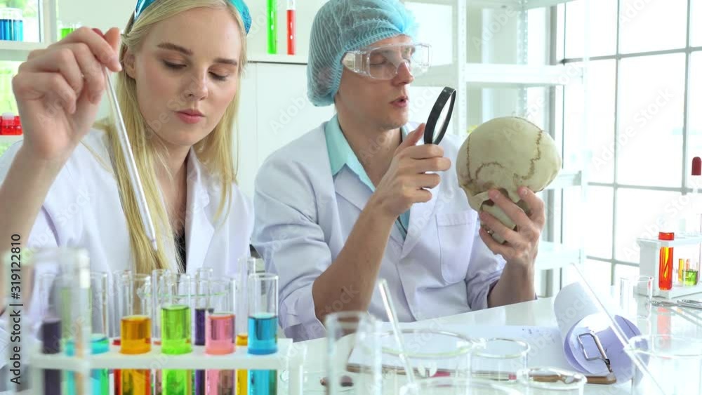 Young man and woman student studying to be a health scientist in the laboratory Young man and woman student studying to be a health scientist in the laboratory