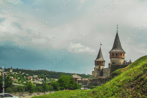 Photo of ancient stone castle with many hight towers in Kamyanets-Podilsky