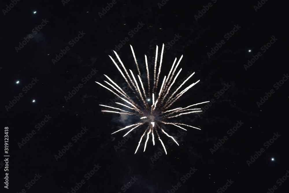 A flash of plain white fireworks. In the night sky A flash of plain white fireworks. In the night sky