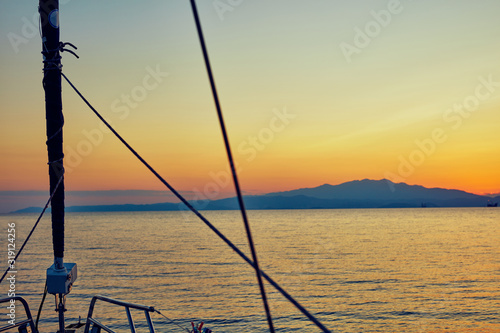 View of a sailing ship front deck and open sea.