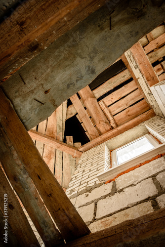 Wooden ceiling beams. Detail of house room interior under construction and renovation.