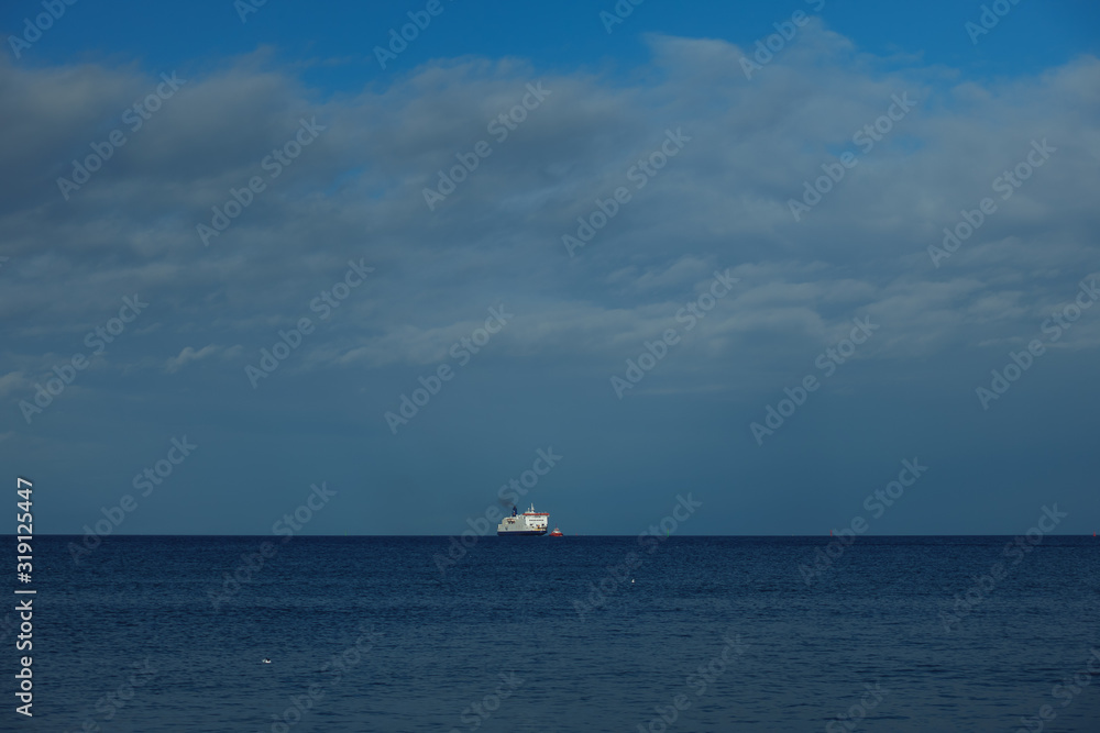 Ship on the horizon of a baltic sea