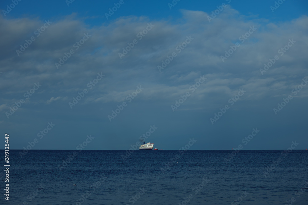 Ship on the horizon of a baltic sea Ship on the horizon of a baltic sea