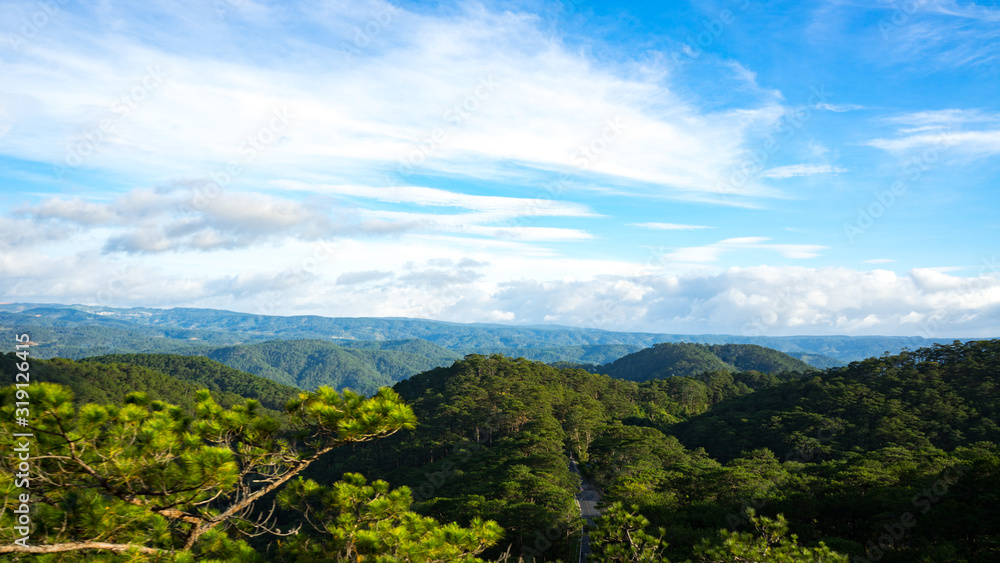 Mountain landscapes covered with forests up to the horizon in the city of Dalat in Vietnam.