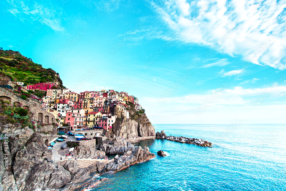 Beautiful magic colorful summer landscape on the coast of Manarola in Cinque Terre, Liguria, Italy.  Exotic amazing places. Popular tourist atraction.