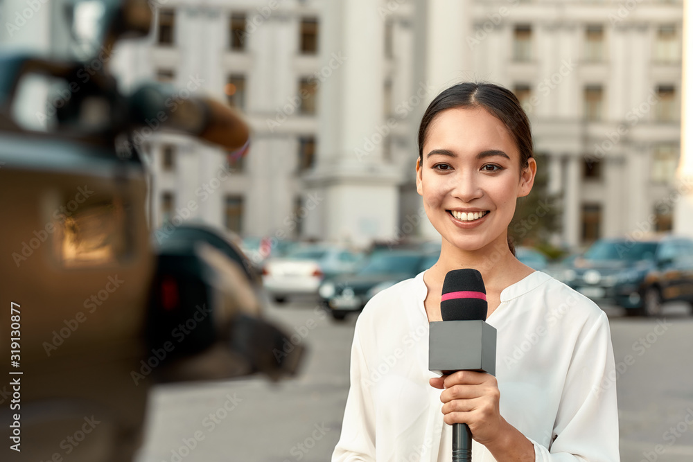 TV reporter presenting the news outdoors. Journalism industry, live streaming concept.