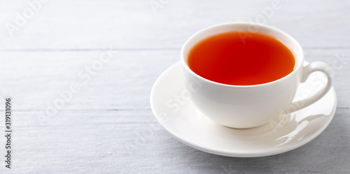 Cup of tea on a grey wooden background. Copy space. Close up.