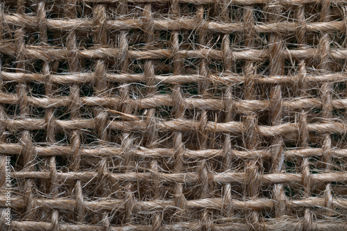 Texture of linen fabric, close up. background with holes in fabric