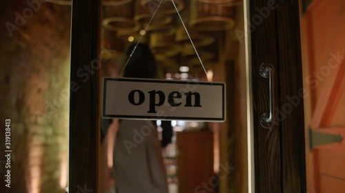 closed sign flipped to open