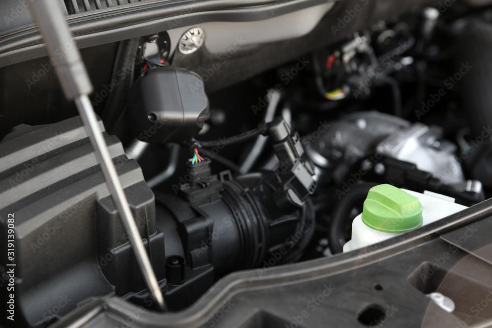 Closeup view of engine bay in modern car Closeup view of engine bay in modern car