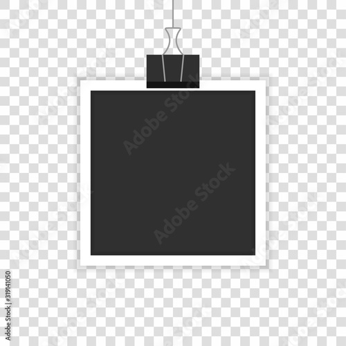 A realistic photo hanging on fortified is depicted in a transparent background.