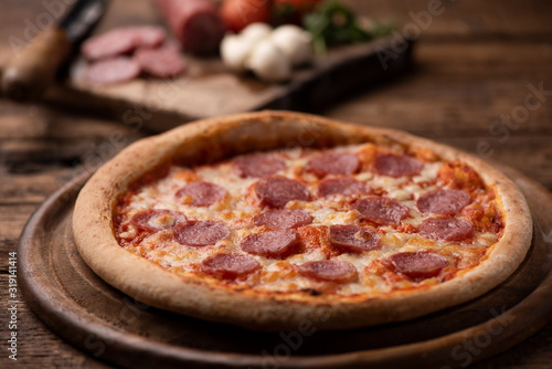 Pepperoni Pizza on wooden table