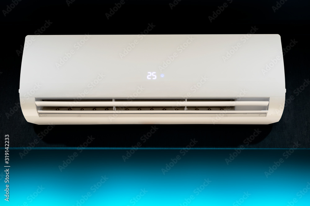 inverter air conditioner system technology with temperature display and motion sensor, indoor fan coil unit is installed on modern dark grey wall inverter air conditioner system technology with temperature display and motion sensor, indoor fan coil unit is installed on modern dark grey wall