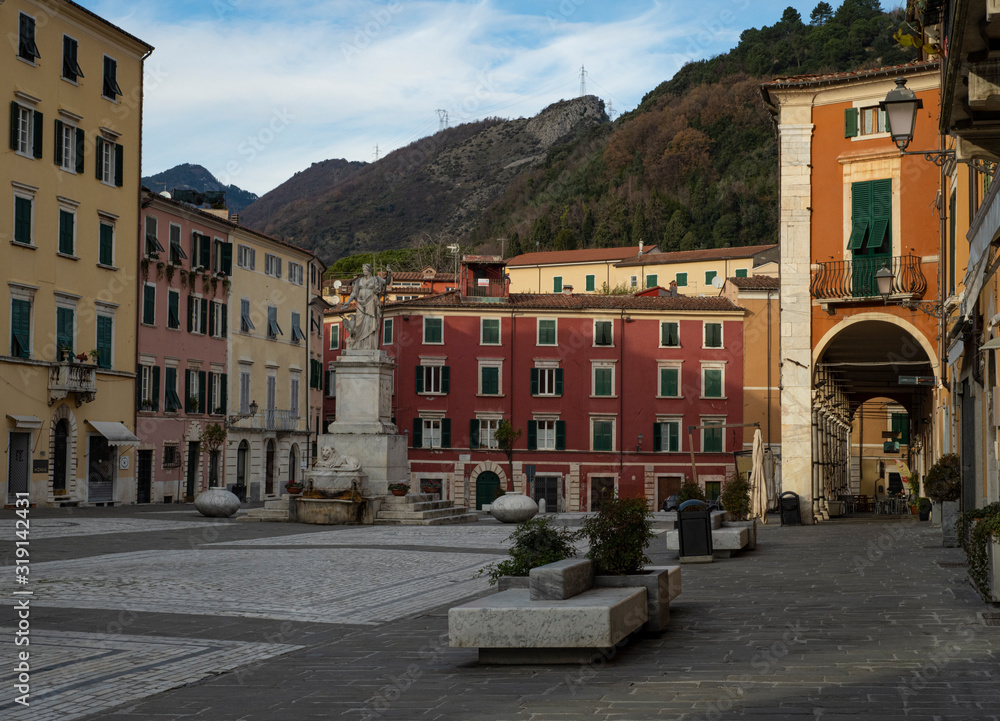Colorful buildings and empty seats Carrara