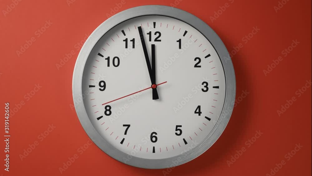 time lapse close-up clock goes fast arrows on red wall time lapse close-up clock goes fast arrows on red wall