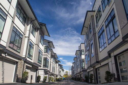 Rows of townhomes side by side. External facade of a row of colorful modern urban townhouses. brand new houses just after construction on real estate market