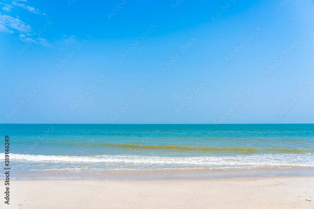 Beautiful tropical sea ocean around beach with blue sky white cloud