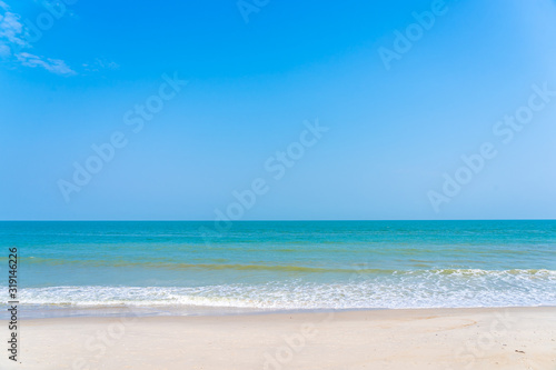 Beautiful tropical sea ocean around beach with blue sky white cloud