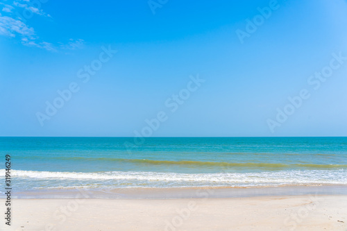 Beautiful tropical sea ocean around beach with blue sky white cloud