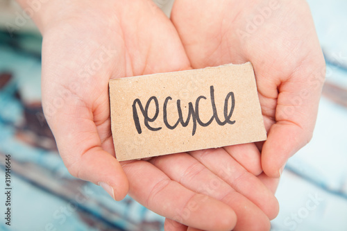 Recycle and upcycle concept or message in human hands