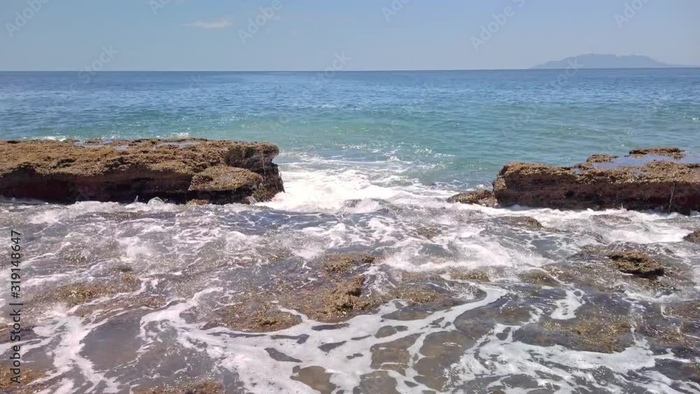 Waves crashing on to the rocky shoreline Waves crashing on to the rocky shoreline