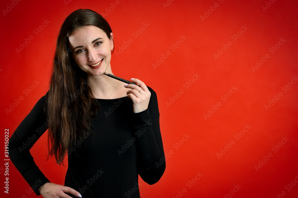 Photo of a pretty young brunette woman with a smile with good makeup on a red background. Concept girl talking in front of the camera with emotions. Photo of a pretty young brunette woman with a smile with good makeup on a red background. Concept girl talking in front of the camera with emotions.