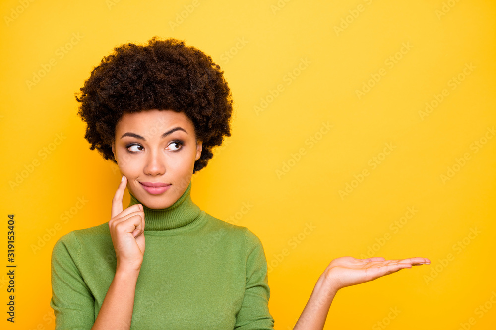 Photo of cheerful cute pretty charming woman holding empty space with hand touching her cheek looking away isolated vivid color background Photo of cheerful cute pretty charming woman holding empty space with hand touching her cheek looking away isolated vivid color background