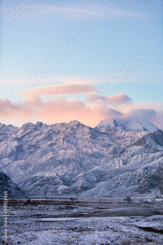Xinjiang China Pamir Plateau snow mountain in winter. Sun rise morning landscape.