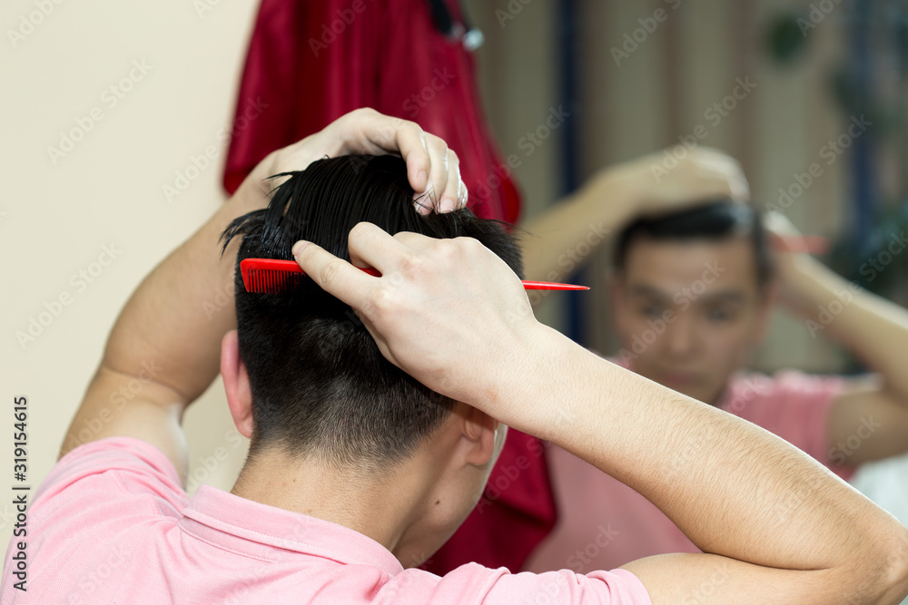 Fototapeta premium man combing hair