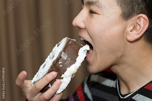 man eating a piece of cake
