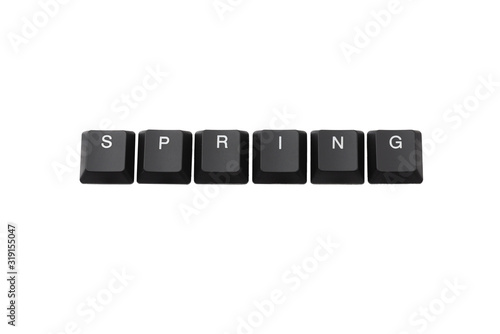 Word spring written on keyboard. Isolated on white. 