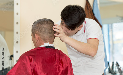 man shaves edging