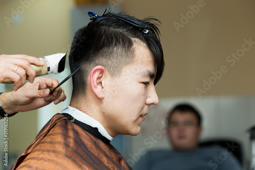 hairdresser cutting customer's hair