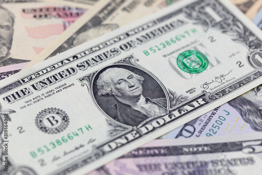 Business background, one dollar bill on american banknotes close up in studio macro photo Business background, one dollar bill on american banknotes close up in studio macro photo
