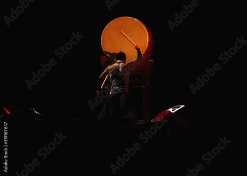 Musician dramming on Japanese taiko