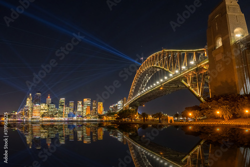 The Sydney Harbour Bridge and the city at night during Vivid Annual Festival of light