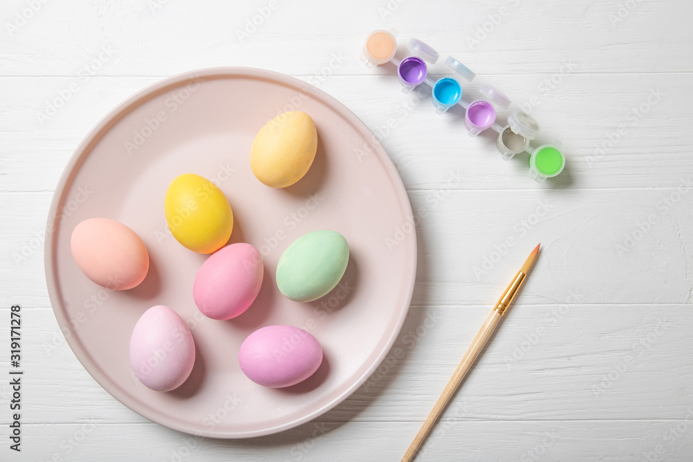 Multi-colored Easter eggs and paint brush. Multi-colored Easter eggs and paint brush.